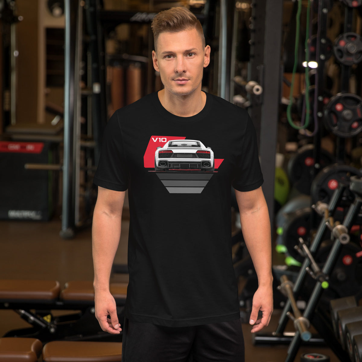 The Sensible Supercar Tee, Black — worn front view, gym setting, Marque automotive apparel