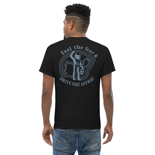 Black Feel the Fear back print tee worn from behind — driver badge and DRIVE FAST ANYWAY across the shoulders