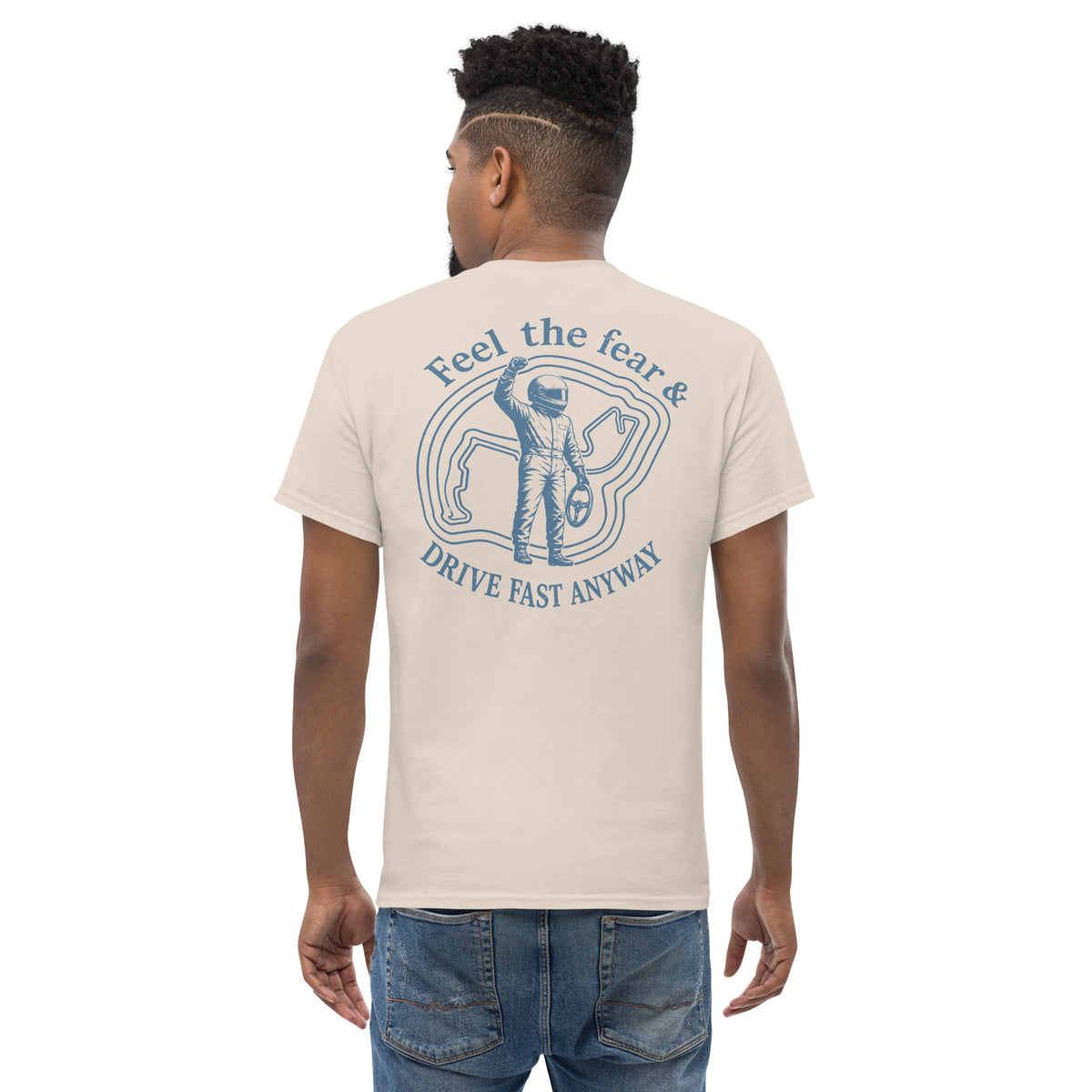 Natural Feel the Fear back print tee worn from behind, pale ground with the driver badge in grey
