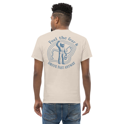 Natural Feel the Fear back print tee worn from behind, pale ground with the driver badge in grey