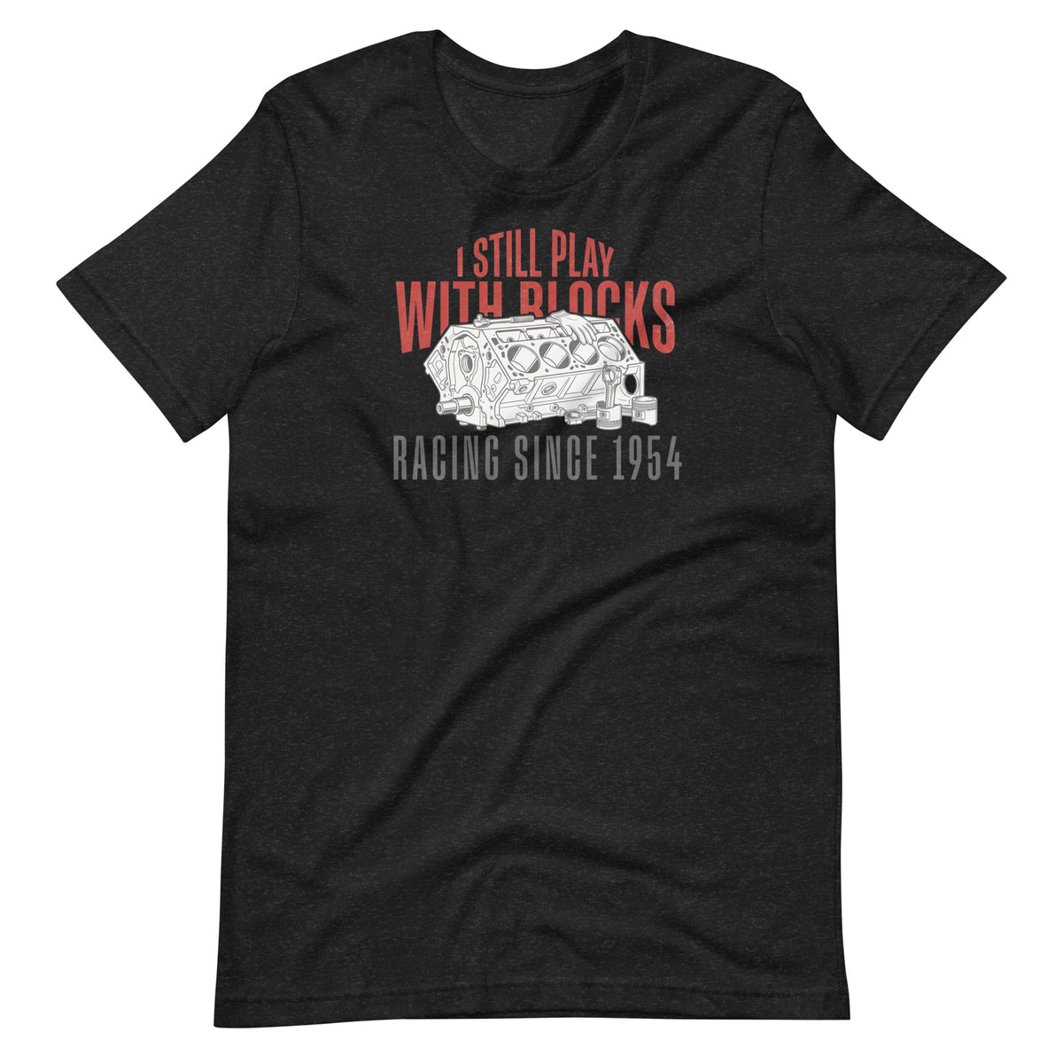 I Still Play With Blocks Tee, Black Heather front view — bare V8 block line art with slogan print, Marque automotive apparel