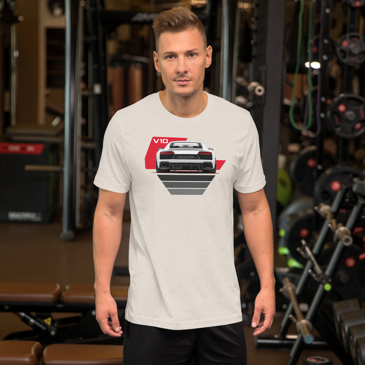 The Sensible Supercar Tee, Heather Dust — worn front view, gym setting, Marque automotive apparel