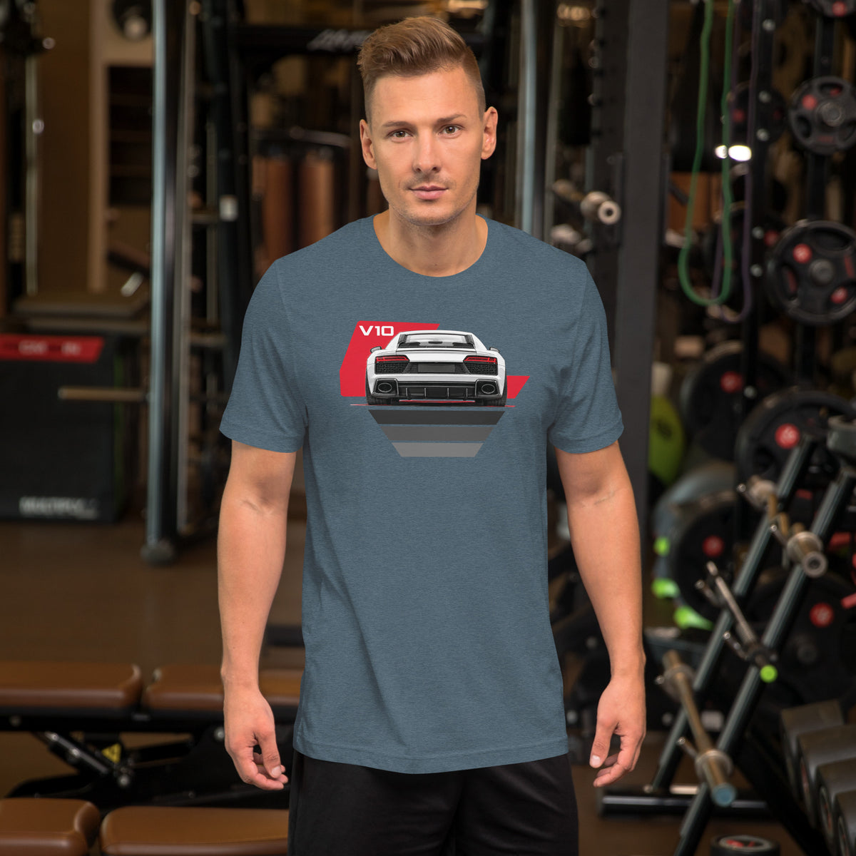 The Sensible Supercar Tee, Heather Slate — worn front view, gym setting, Marque automotive apparel