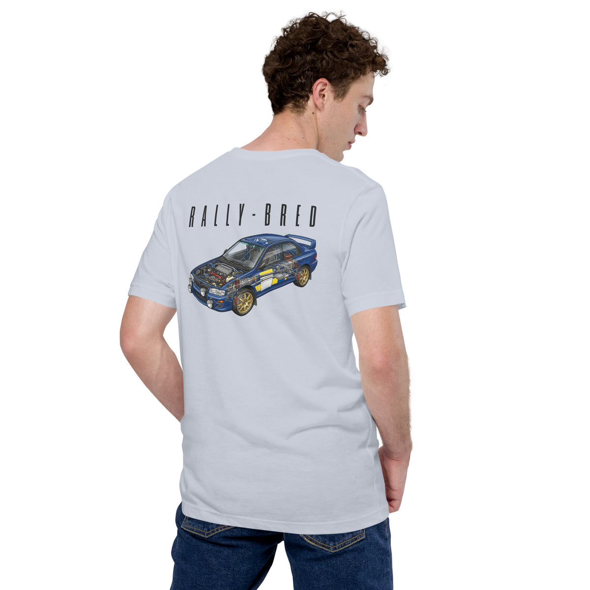 Rally-Bred Tee, Light Blue — worn back view showing the rally cutaway print, Marque automotive apparel
